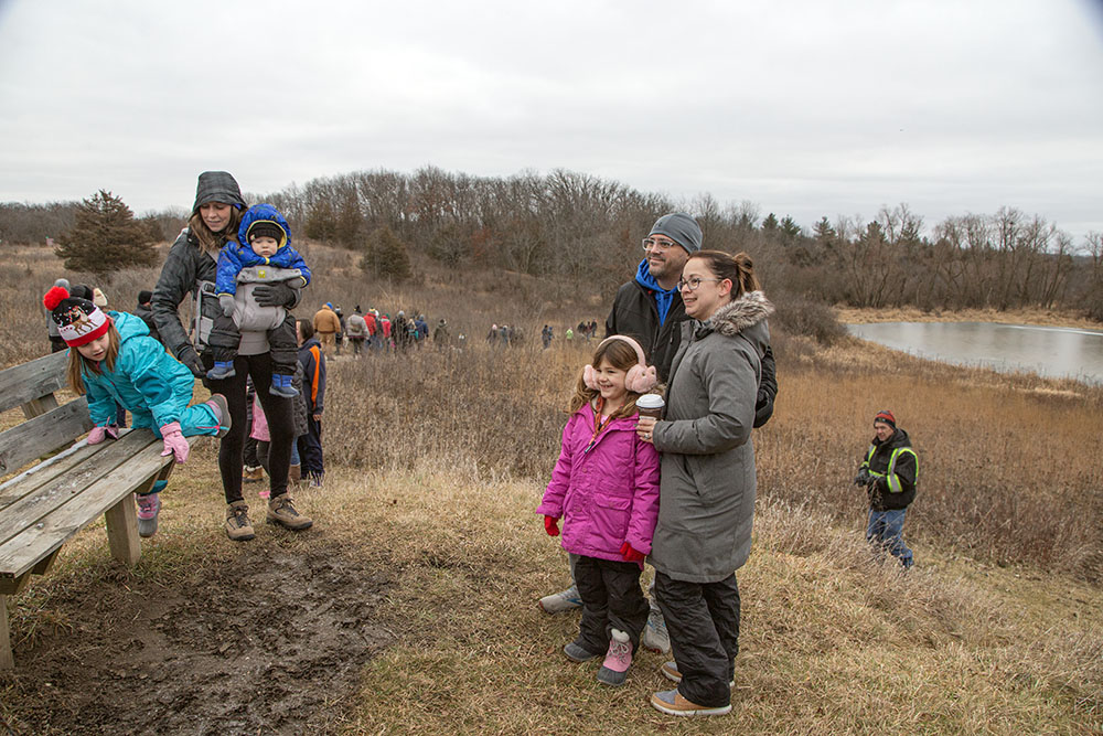 A selfie stop at the top of a rise overlooking a pond.