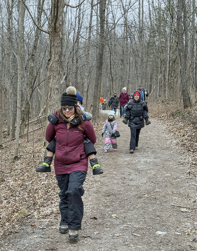 A couple of young hikers riding piggyback!