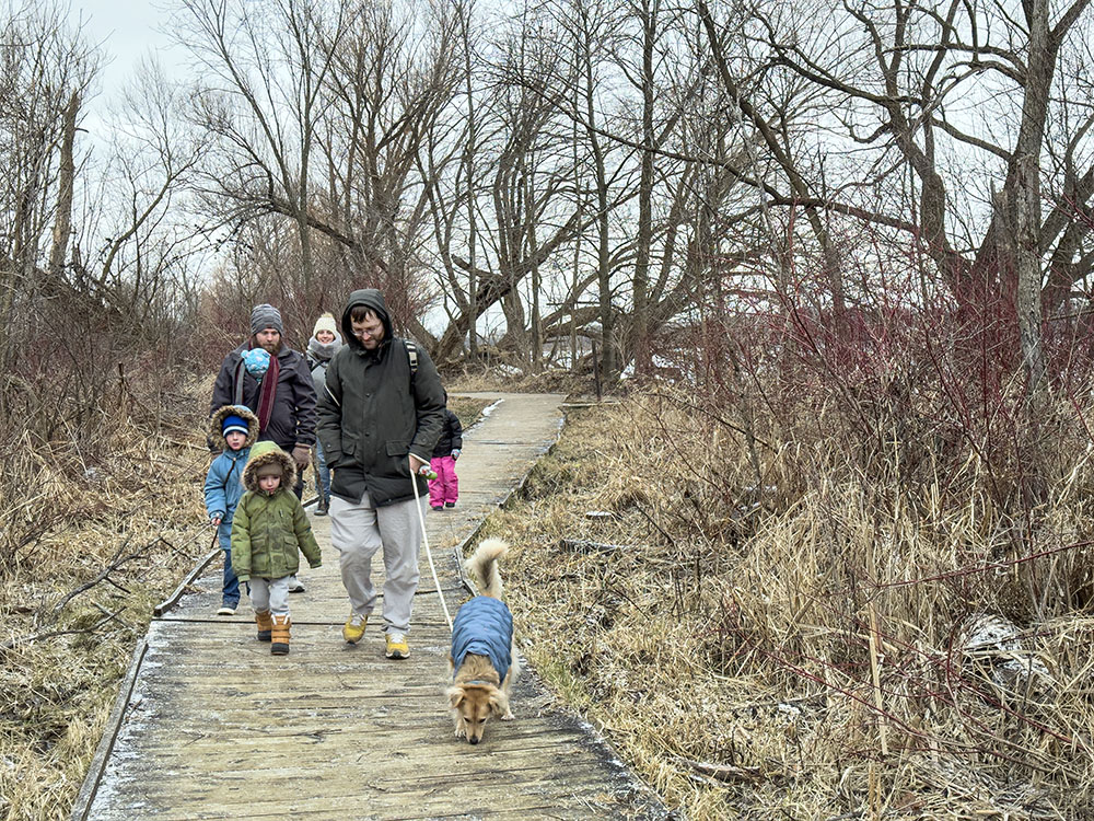 A family embarks on the lakeside accessible loop.