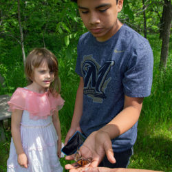 A Boy and a girl with a monarch butterfly