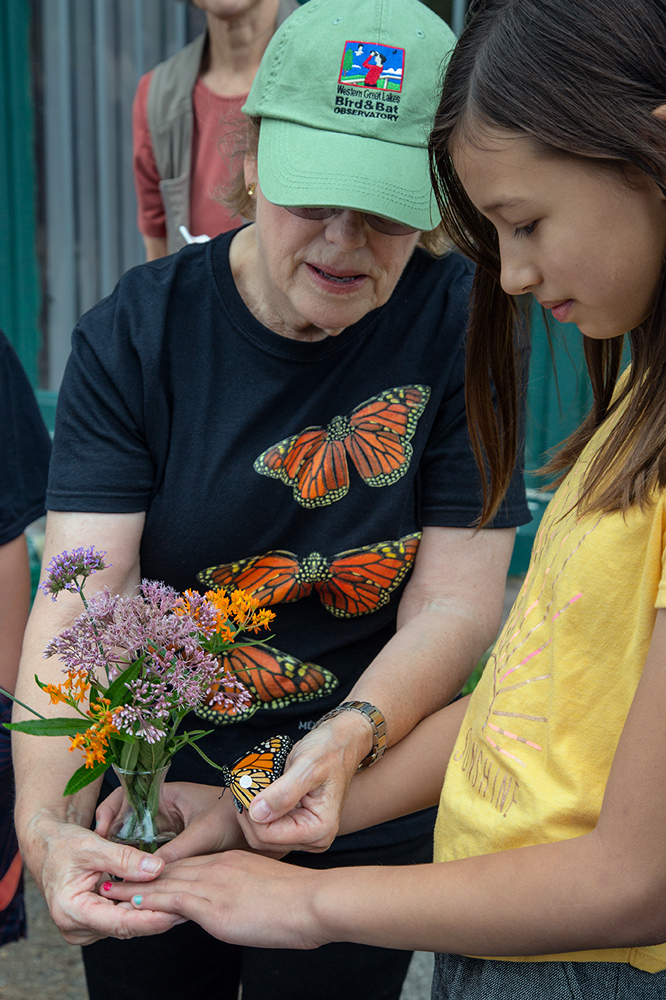 Shelly Culea (left) demonstrates tagging to a young citizen scientist