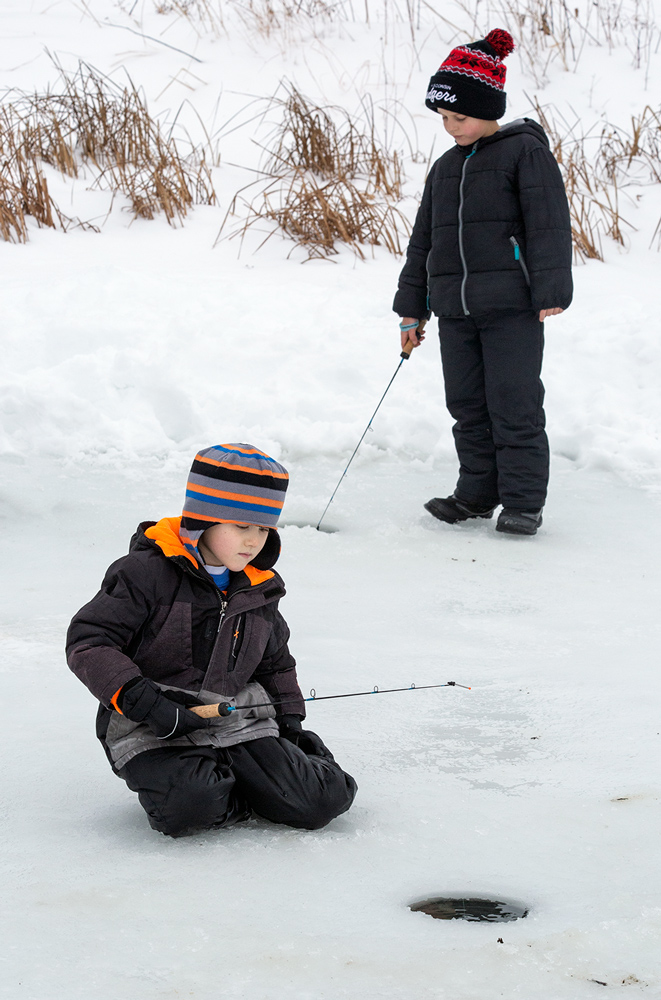 two boys ice fishing