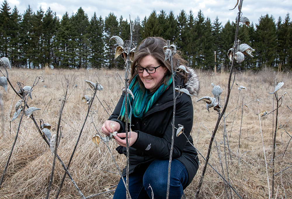 The artist with milkweed pod.