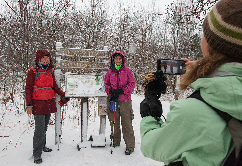 posing by Ice Age Trail sign