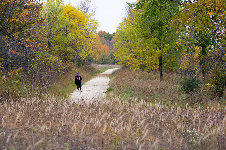 hiker with cellphone in autumn