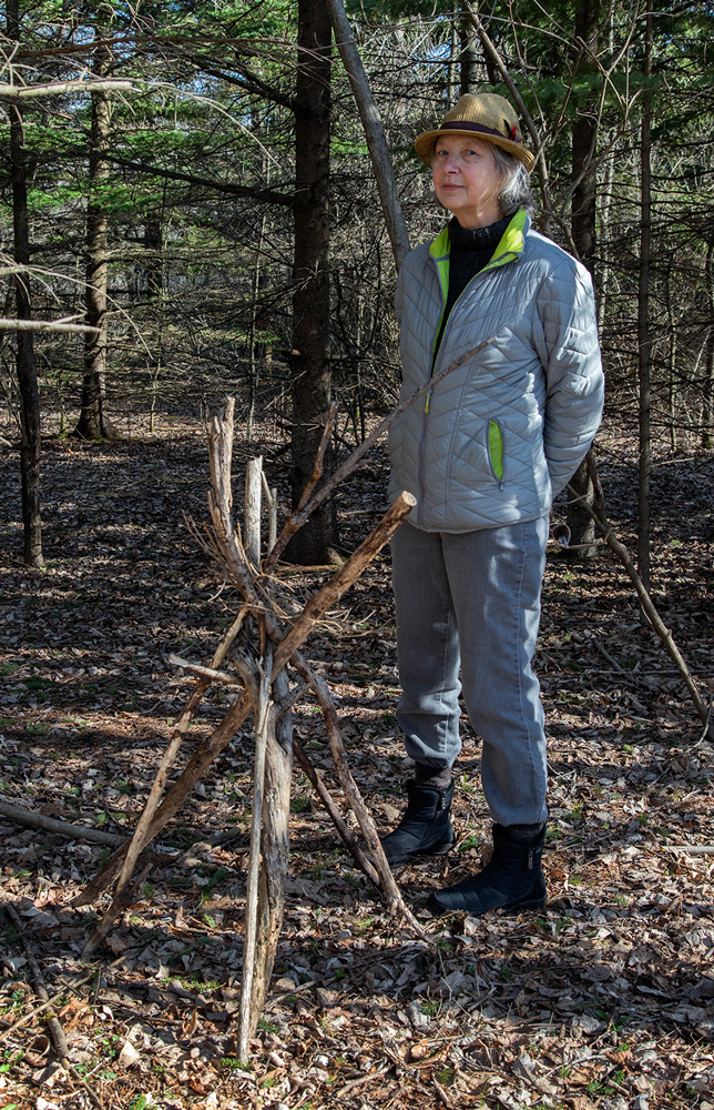 The artist with tepee construction. Photo: Eddee Daniel