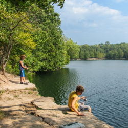 two boys fishing in quarry lake at Harrington Beach State Park