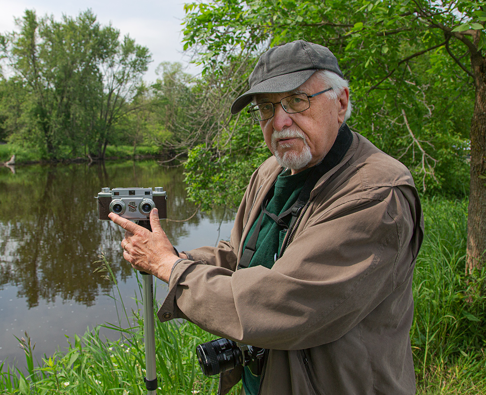 The artist with his twin-lens stereo camera. 