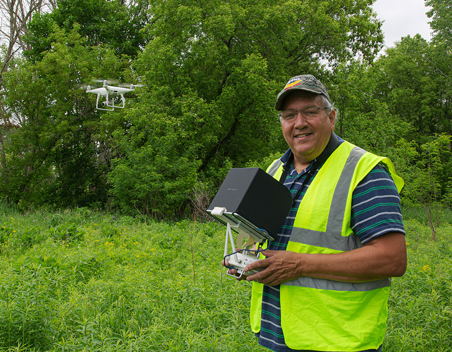 Drone operator Phil Morales with one of his drones in flight