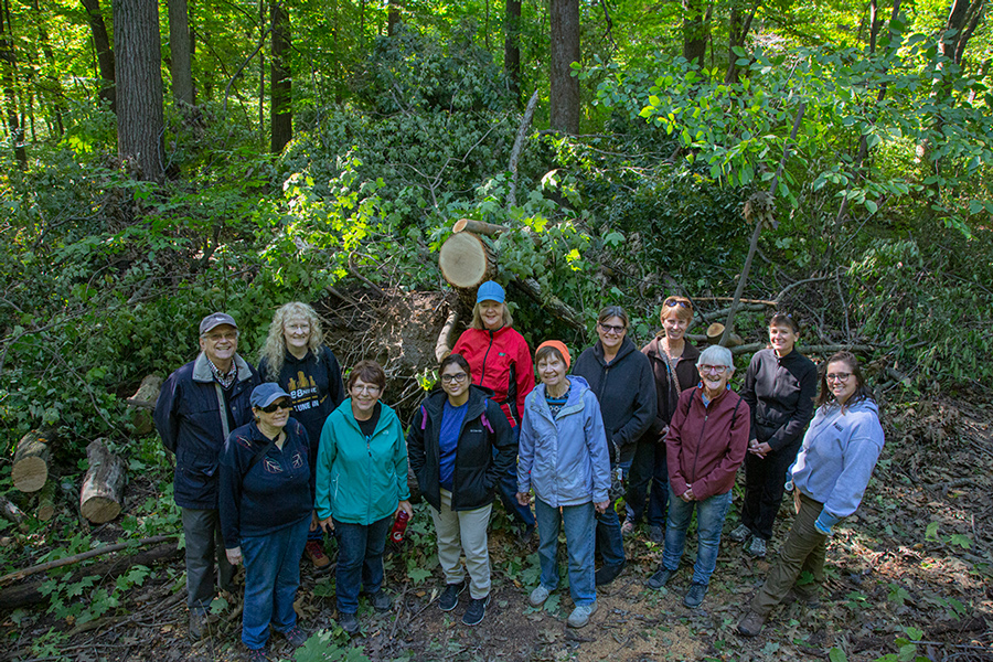 a group posing in a woods