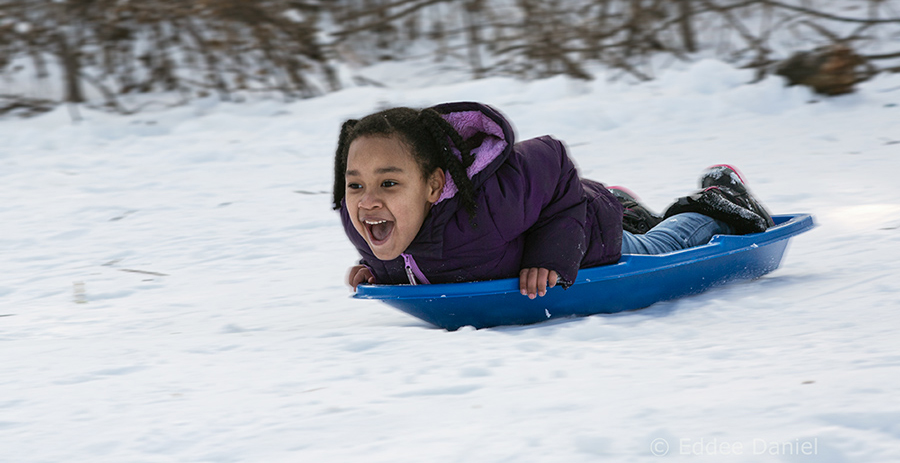 girl sledding