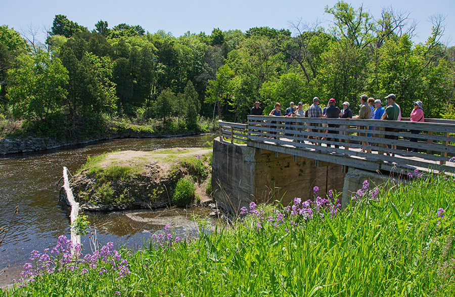 Pedestrian bridge and overlook at former dam site on the Milwaukee River in Lime Kiln Park.