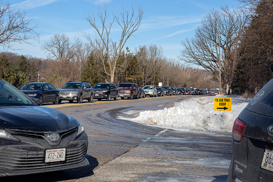 A line of cars waiting at the entrance to Lapham Peak. 