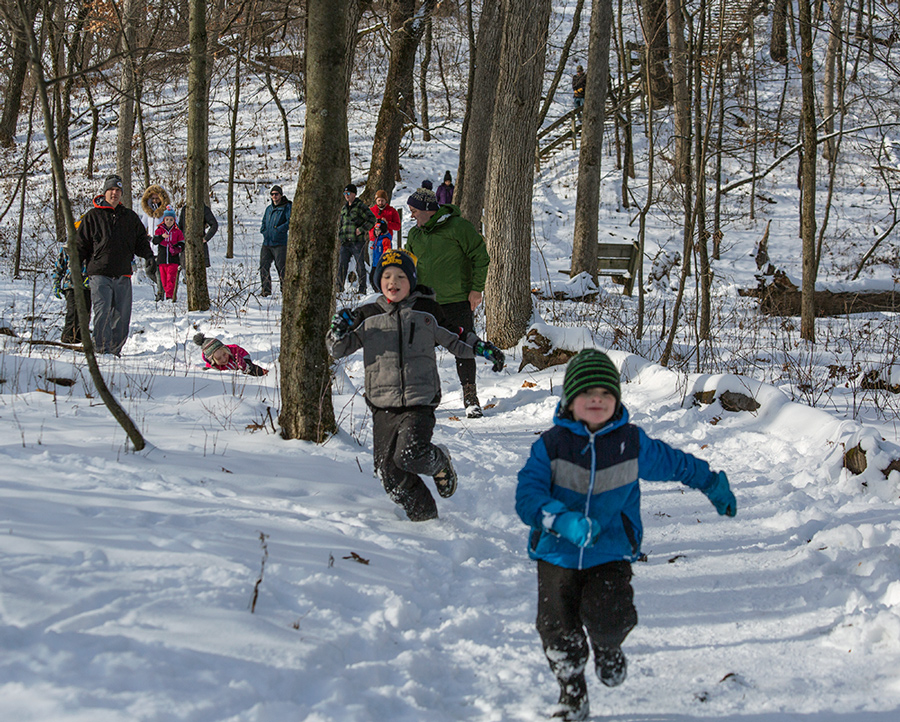 Two young boys running on the Ice Age Trail.