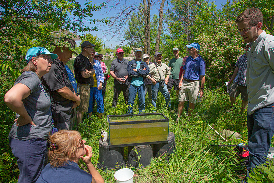 Naturalist Ryan Miller explains to the tour group the importance of restoration work for habitat diversity.