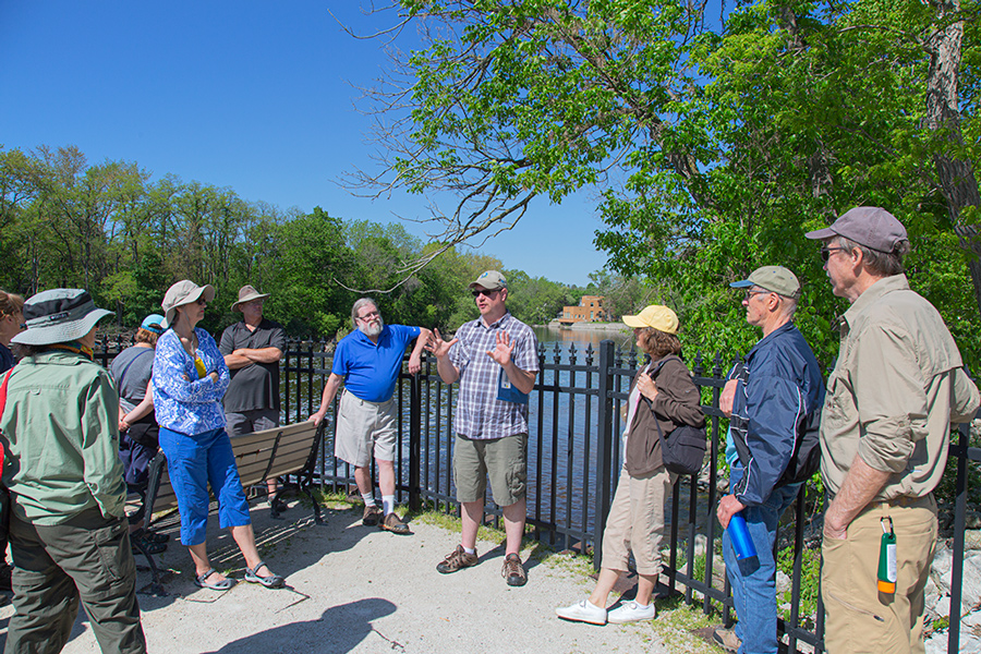 Tour group at Thiensville dam overlook at the Milwaukee River