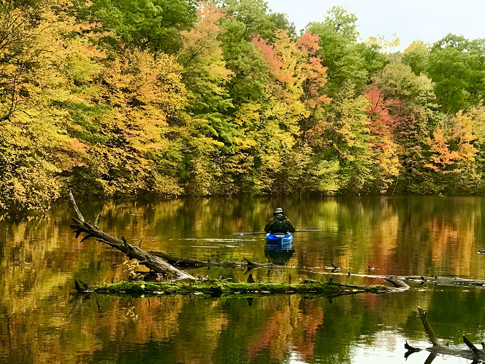 canoe on lake in autumn