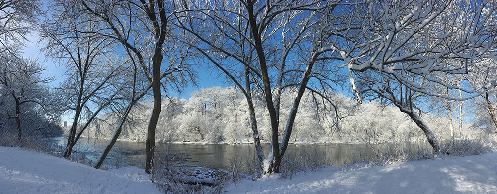 Winter view of snow-covered Milwaukee River banks at Hubbard Park