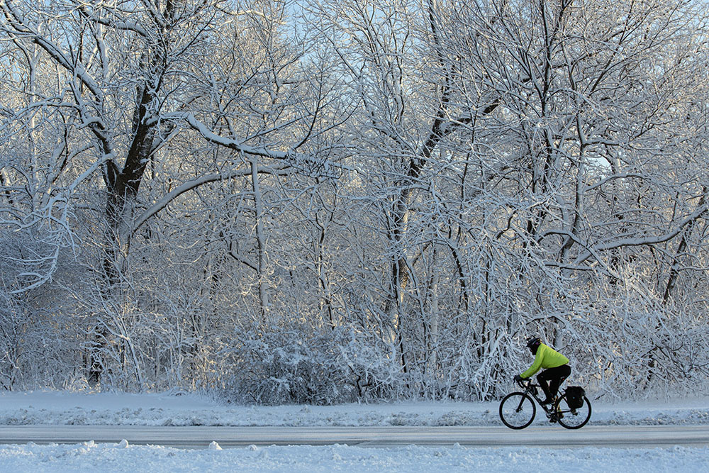 Cyclist in snowy Estabrook Park