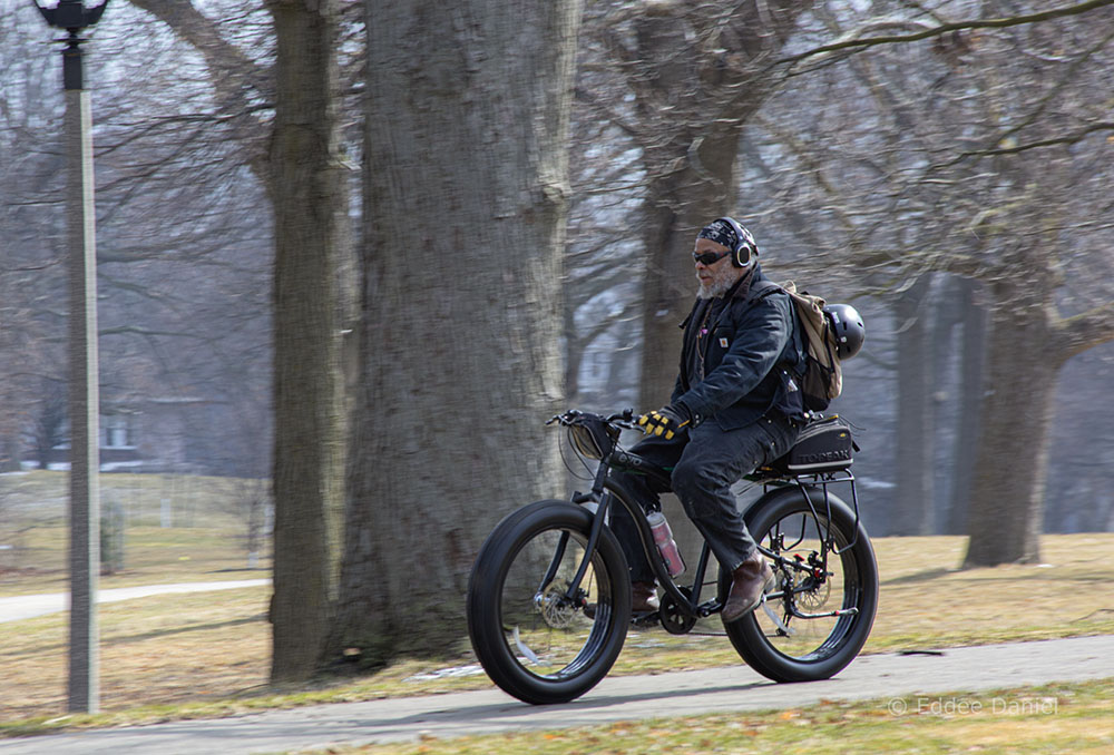 A man riding a fat tire bicycle in Washington Park