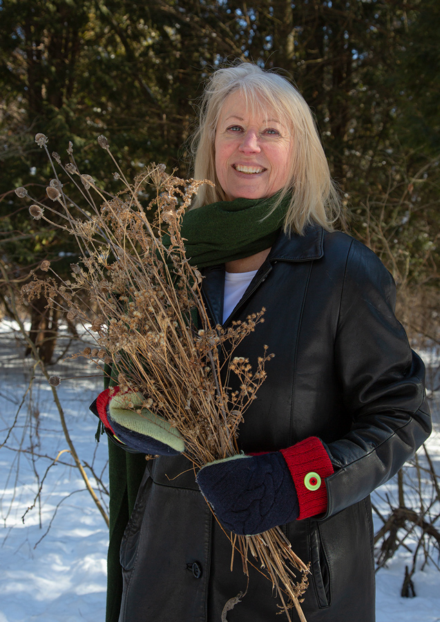 Tori Tasch with collected seed specimens.