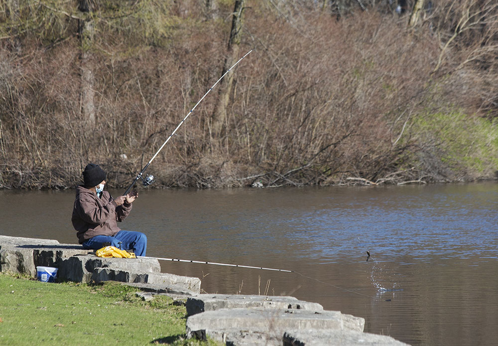 Fishing with a face mask. Jackson Park, Milwaukee