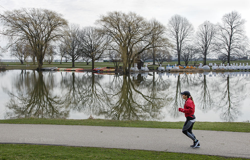 Jogger and lagoon at Veterans Park, Milwaukee, WI.