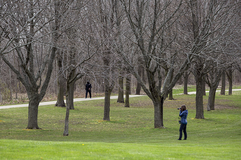 Birder and passerby on the Oak Leaf Trail, Warnimont Park.