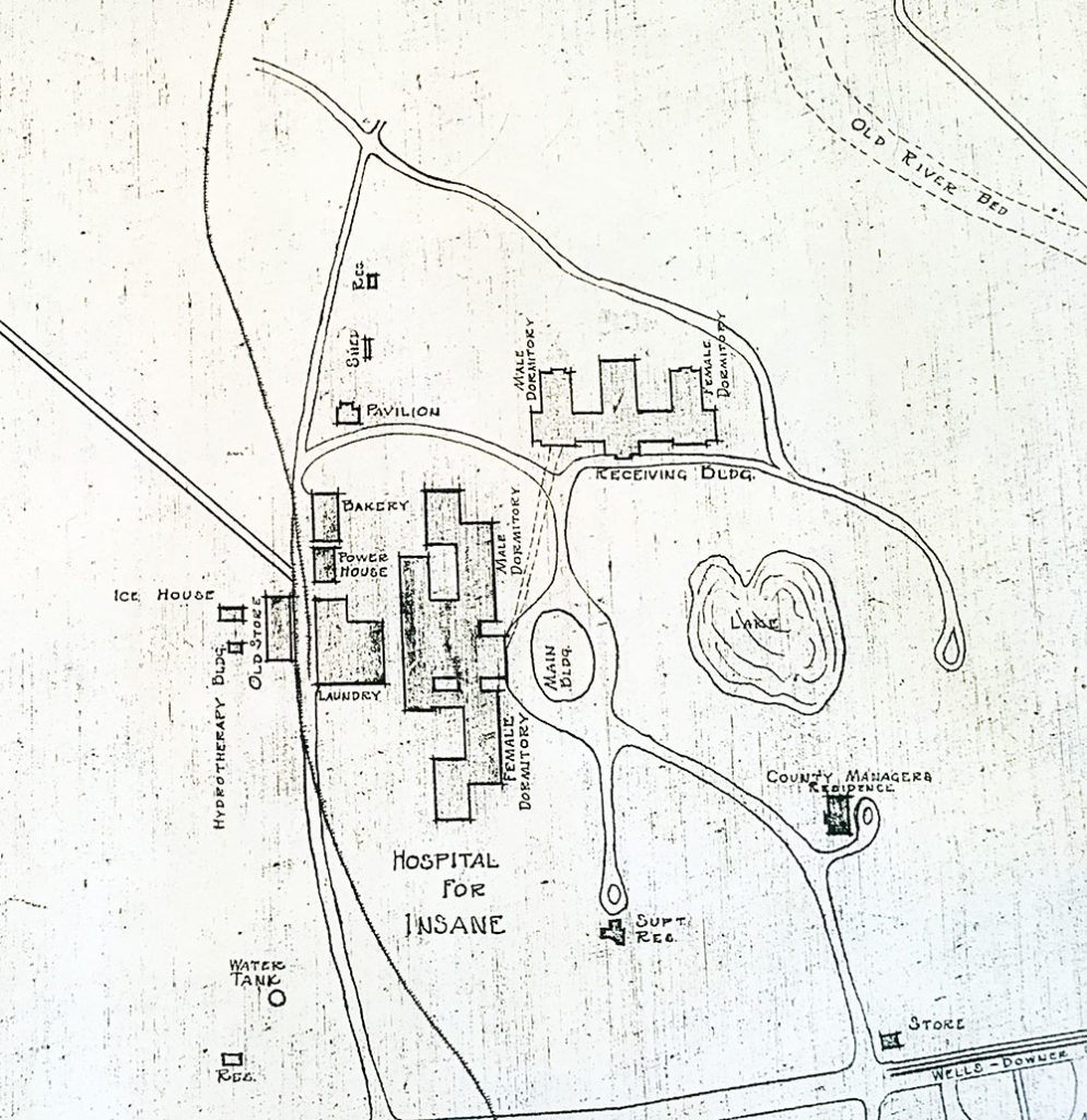 Map showing asylum buildings, carriageways and lake.