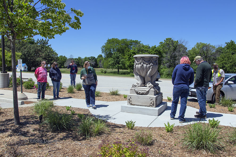 Dolphin urn in its current location behind Ronald McDonald House with Sanctuary Woods in the background.