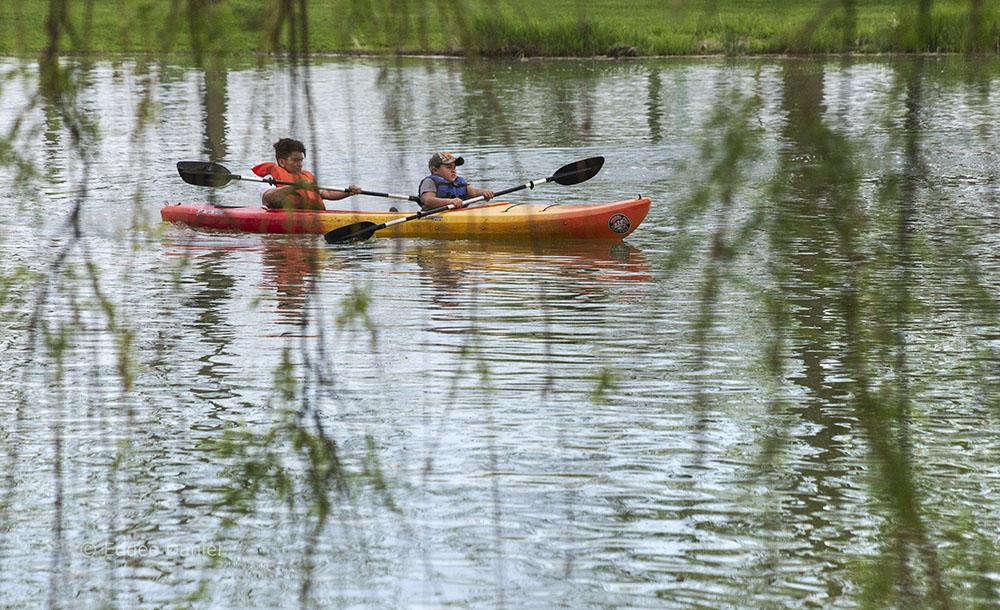 Kids kayaking the lagoon in Veterans Park, Milwaukee.