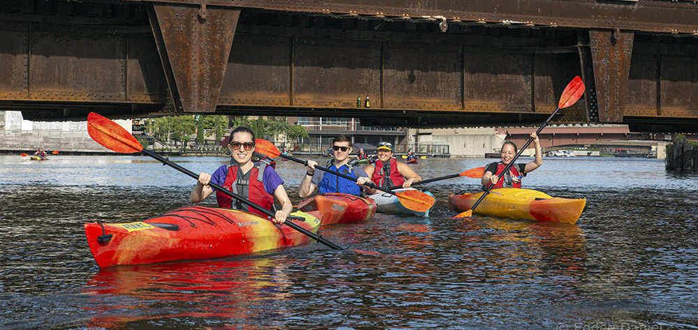 Kayakers entering the Menomonee River.