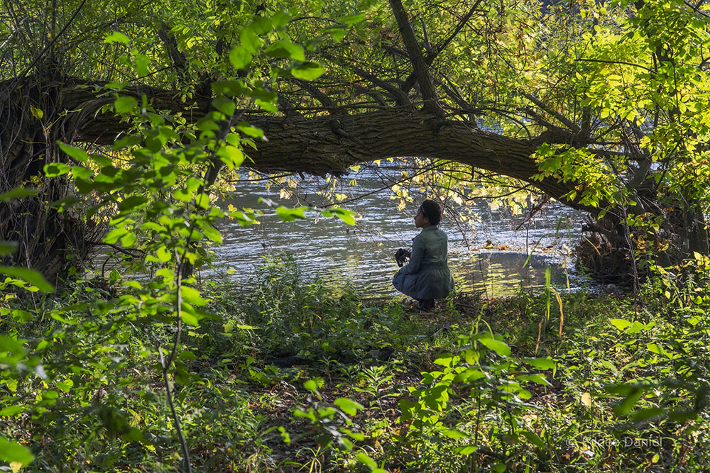 The author exploring the riverbank