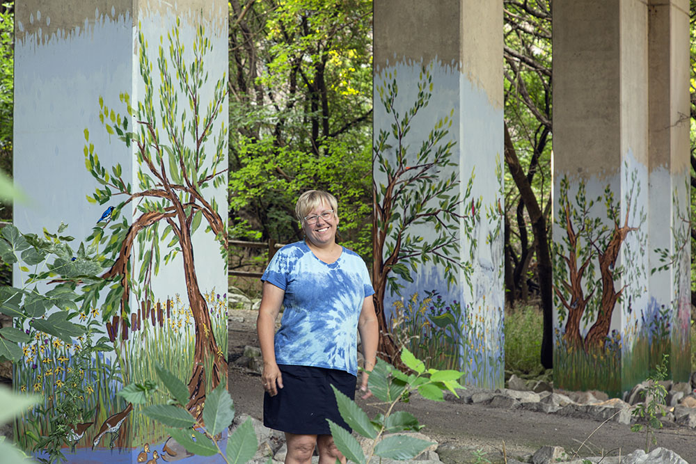 Another long-time friend, artist Melanie Ariens, with her murals under the North Avenue bridge.