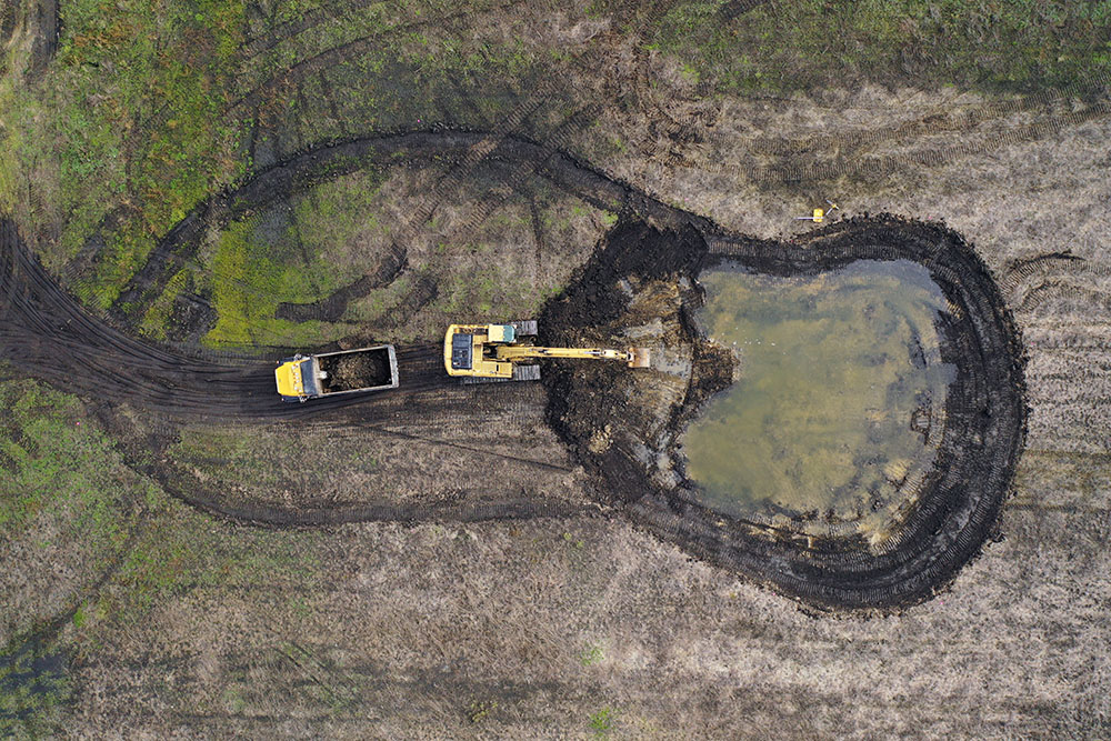  Contractors dug new wetland swales and used the dirt to fill the ditches and restore the water flow to the wetlands.  