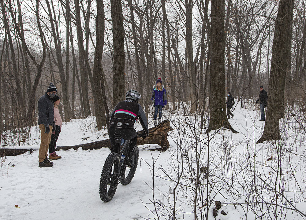 Hikers step aside as cyclist comes through