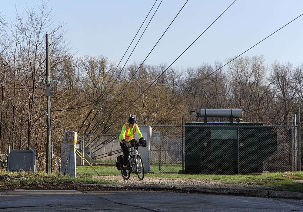 A cyclist behind the Blue Hole and the solar array.