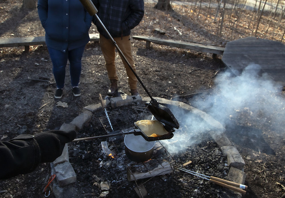 Checking a pancake to see if it is done. 