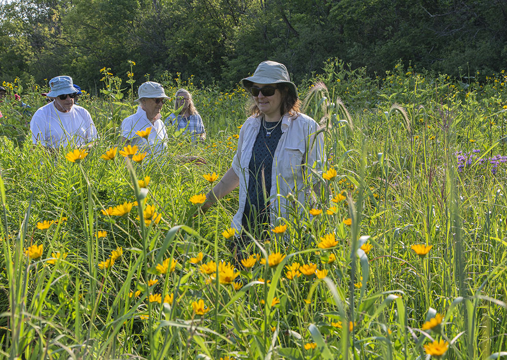 OdeMakwa, one of the designers of the trail from the Healing Nature Center, leads a tour through the prairie.