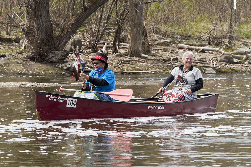 Menominee Water Protectors Jwin Zillier and Dawn Wilbur enjoy their canoe journey on the Milwaukee RIver.