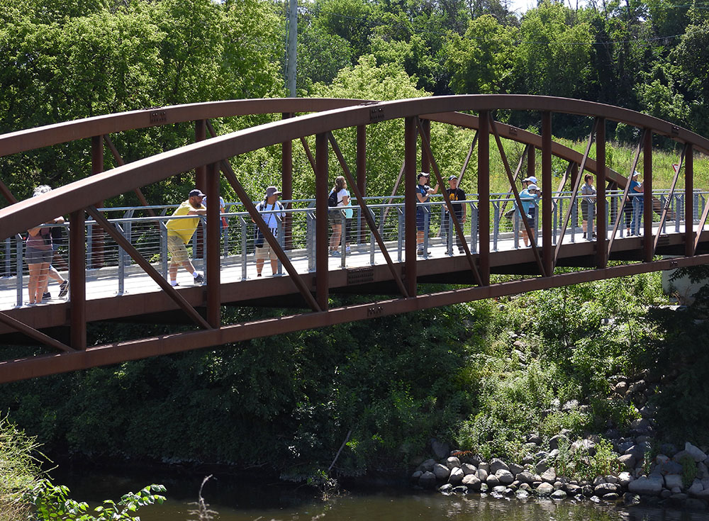 The group spread out along one of the three eponymous bridges leading into the park