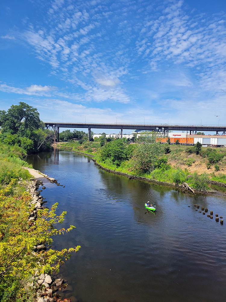 A lone kayaker on the Menomonee River.