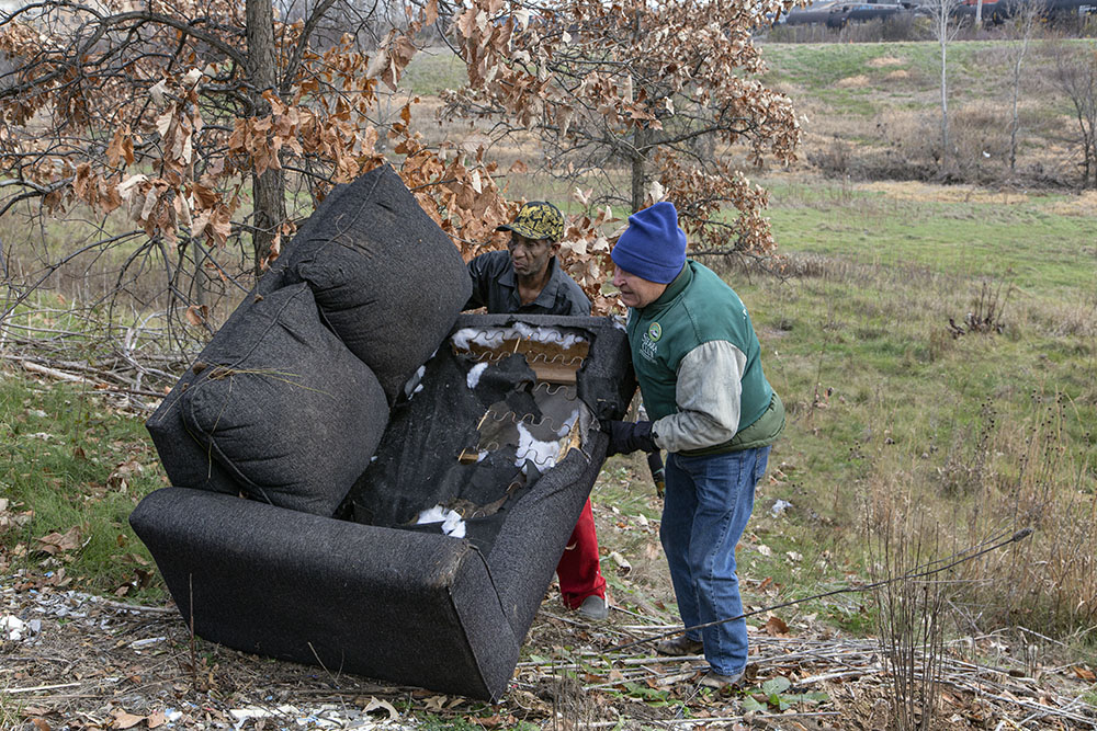 The effort included cleaning up trash and items like this couch that had been discarded in the Greenway.