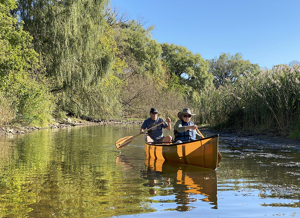 Friends and I took advantage of an unseasonably warm day in mid-October to go boating on the Milwaukee River in Lincoln Park, amid still-green foliage.