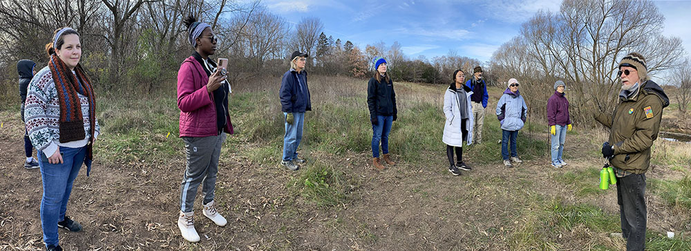 Nearby Nature Project Coordinator David Thomas (far right) explains the importance of the Greenway to a group of volunteers.