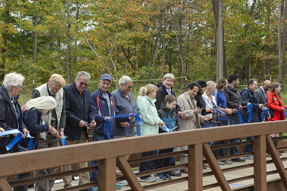 Everyone has a hand in cutting the ribbon!