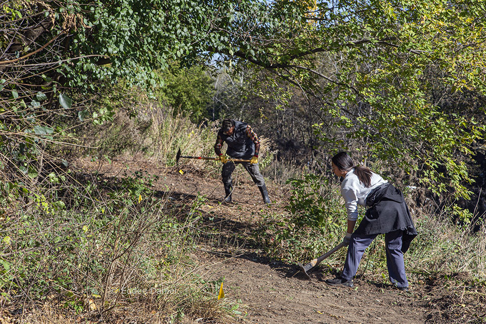 Crew members clearing the new trail.