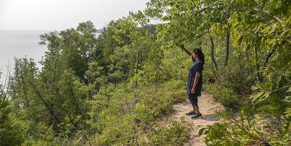 Laj Waghray on the bluff overlooking Lake Michigan at Donges Bay Gorge.