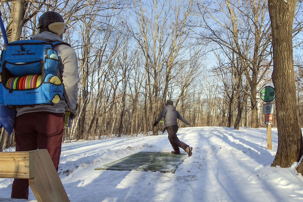 Disc golfing at Sandy Knoll County Park in West Bend.