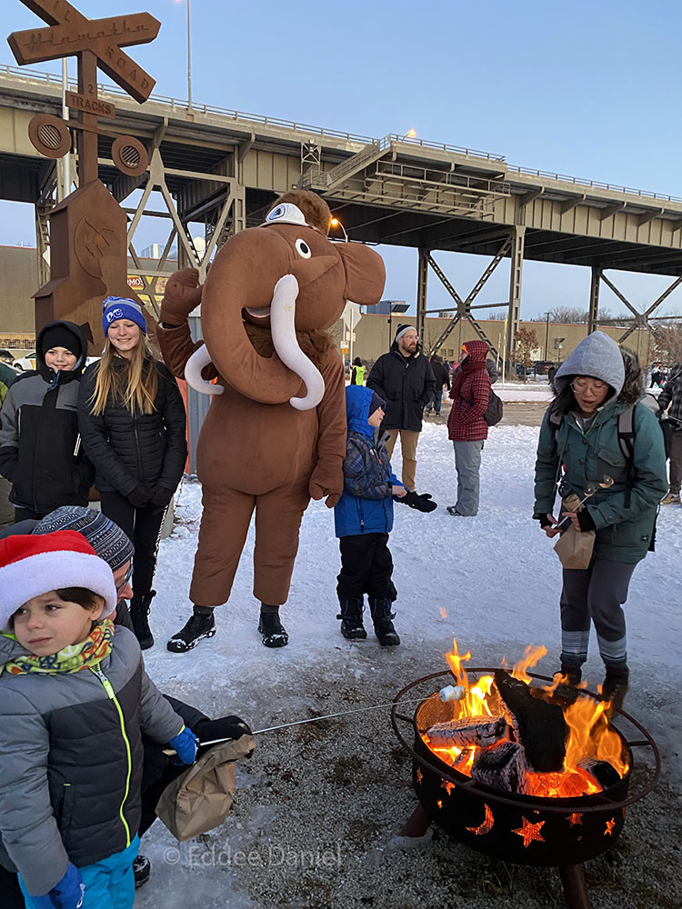 Monty the Mammoth joins in the fun of marshmallow roasting.